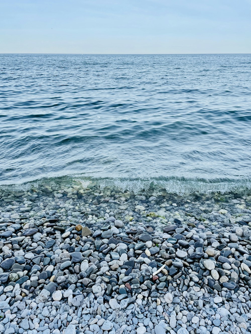 a rocky beach with waves crashing