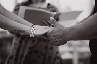 a close-up of hands shaking