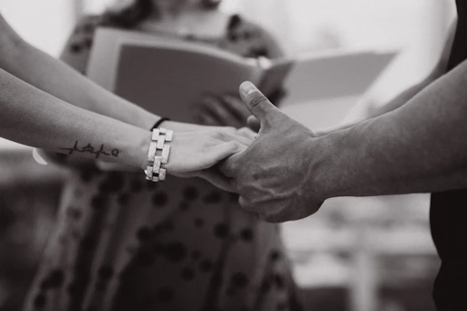 a close-up of hands shaking
