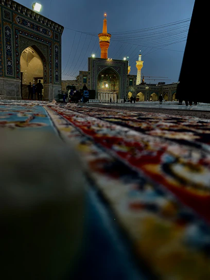 A serene photo of pilgrims walking towards the Kaaba under a golden sunset, framed by subtle Islamic patterns.