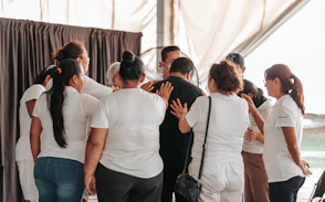 a group of people standing in a room