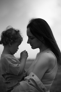 a woman holding a baby