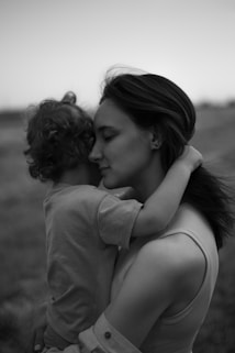 a woman holding a child