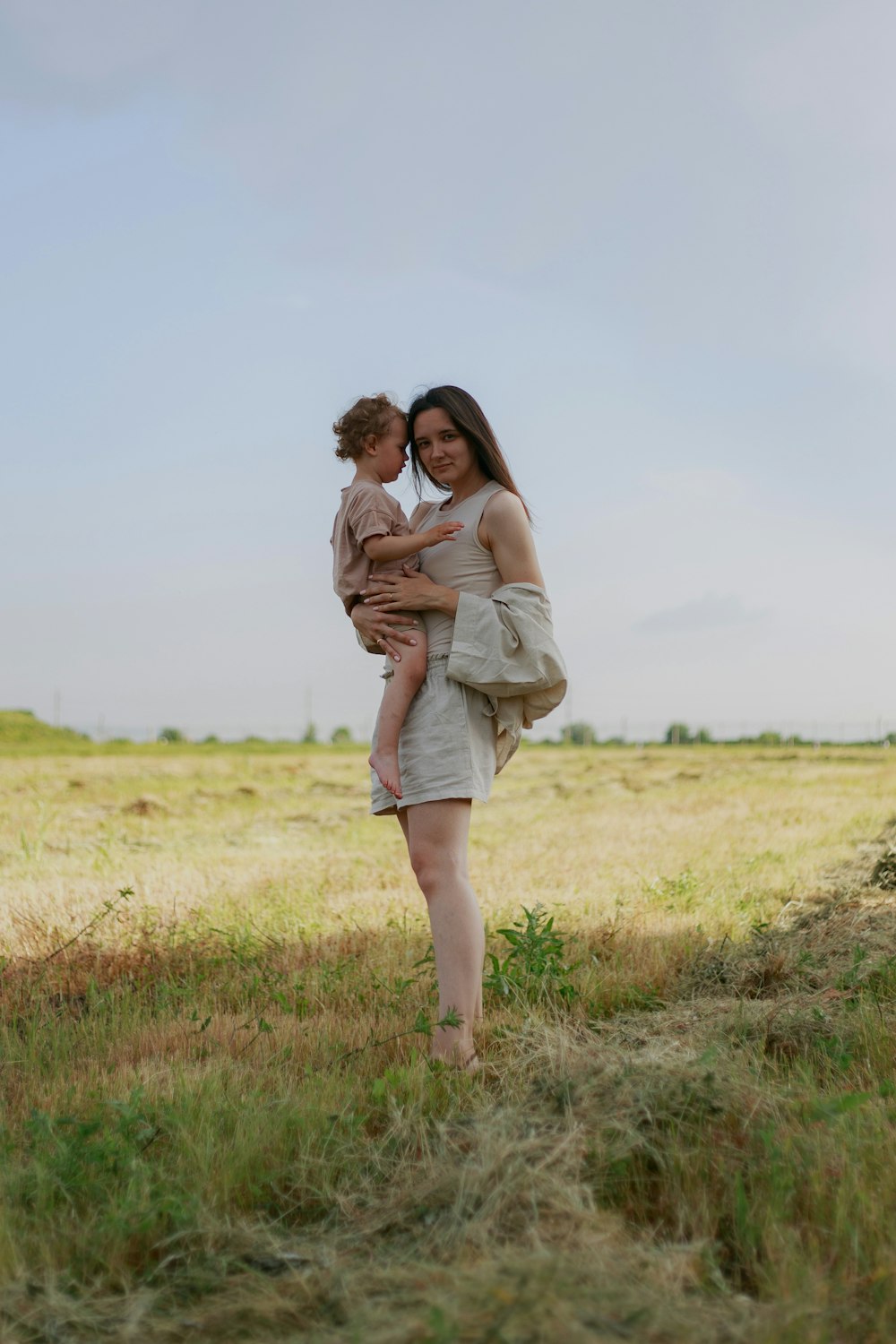 a person carrying a baby