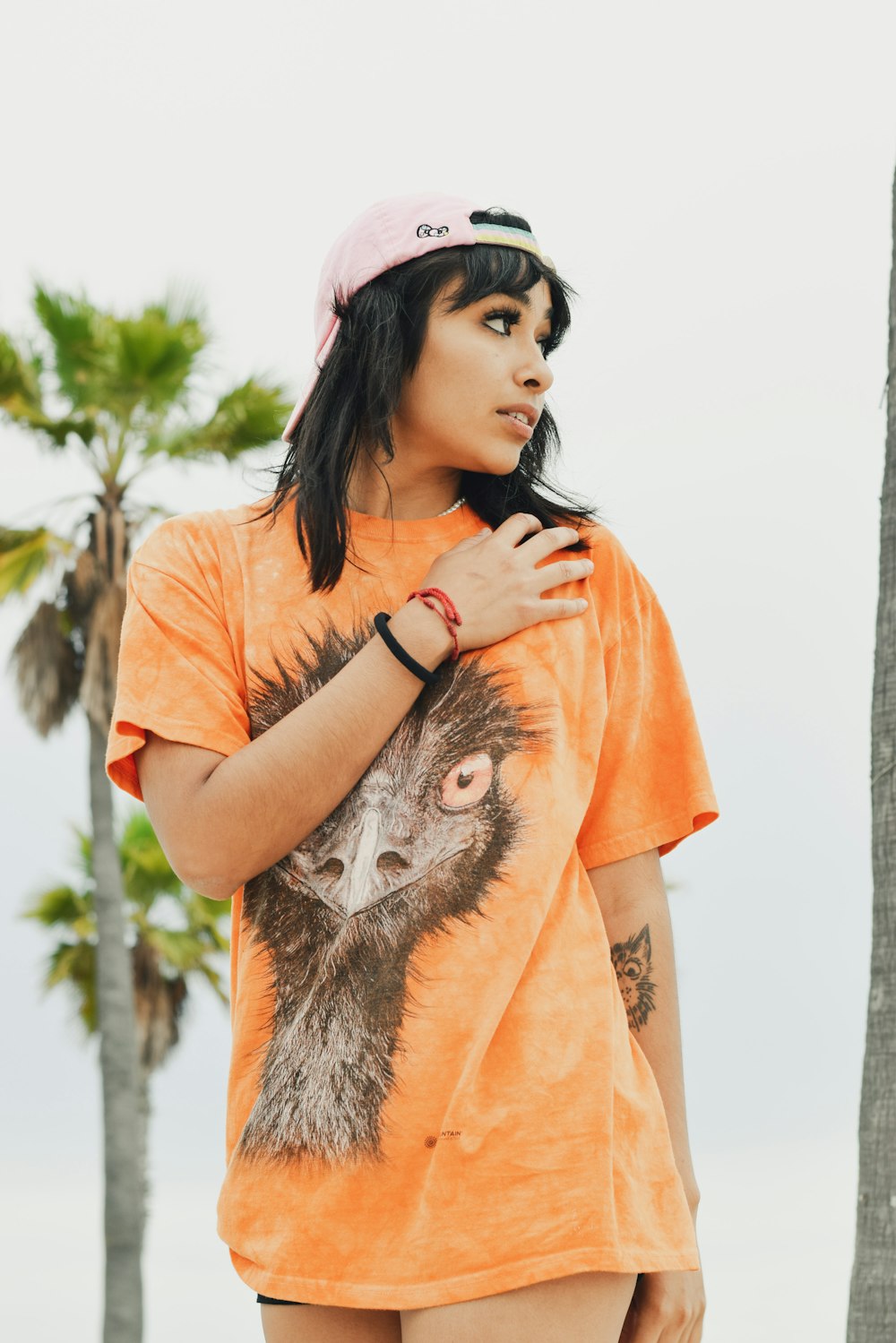 a woman in an orange shirt