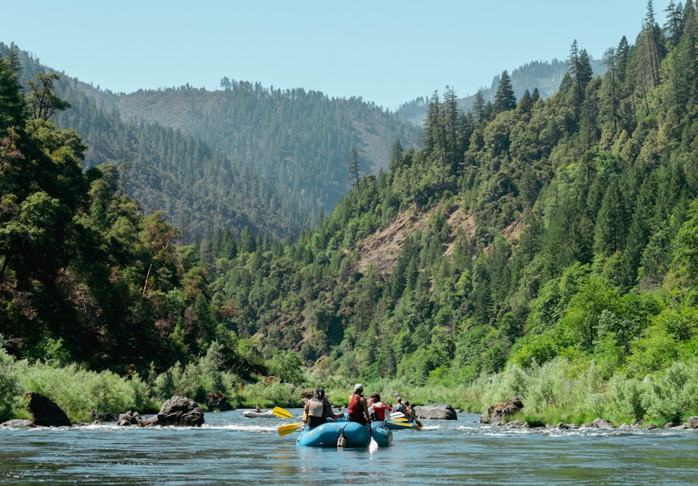 a group of people on a raft in a river