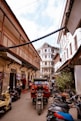 a group of motorcycles parked in a narrow alley