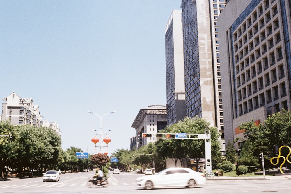 a city street with tall buildings