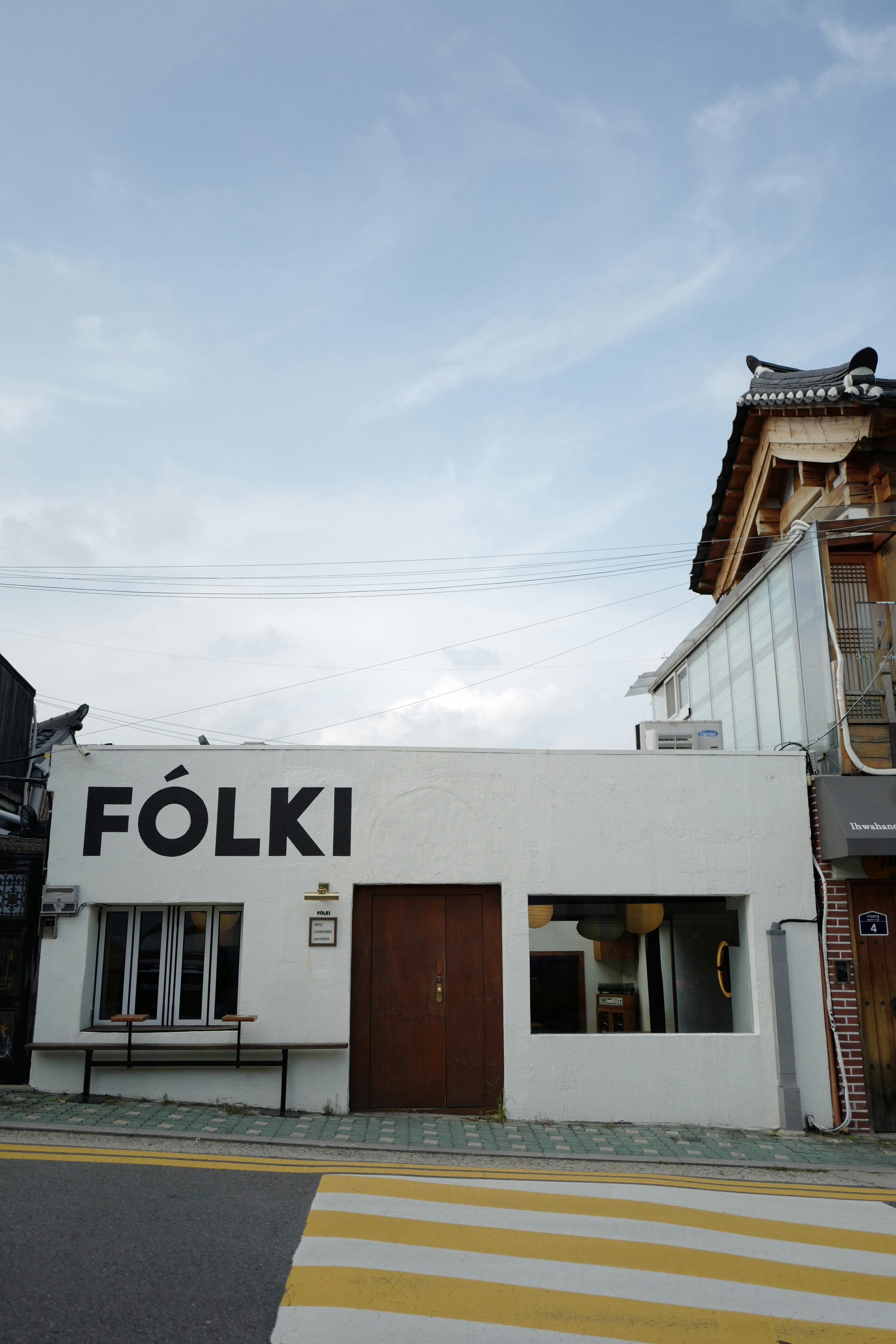 a white building with a sign on it