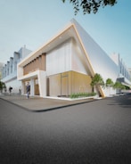 a building with a few people walking around