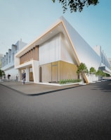 a building with a few people walking around