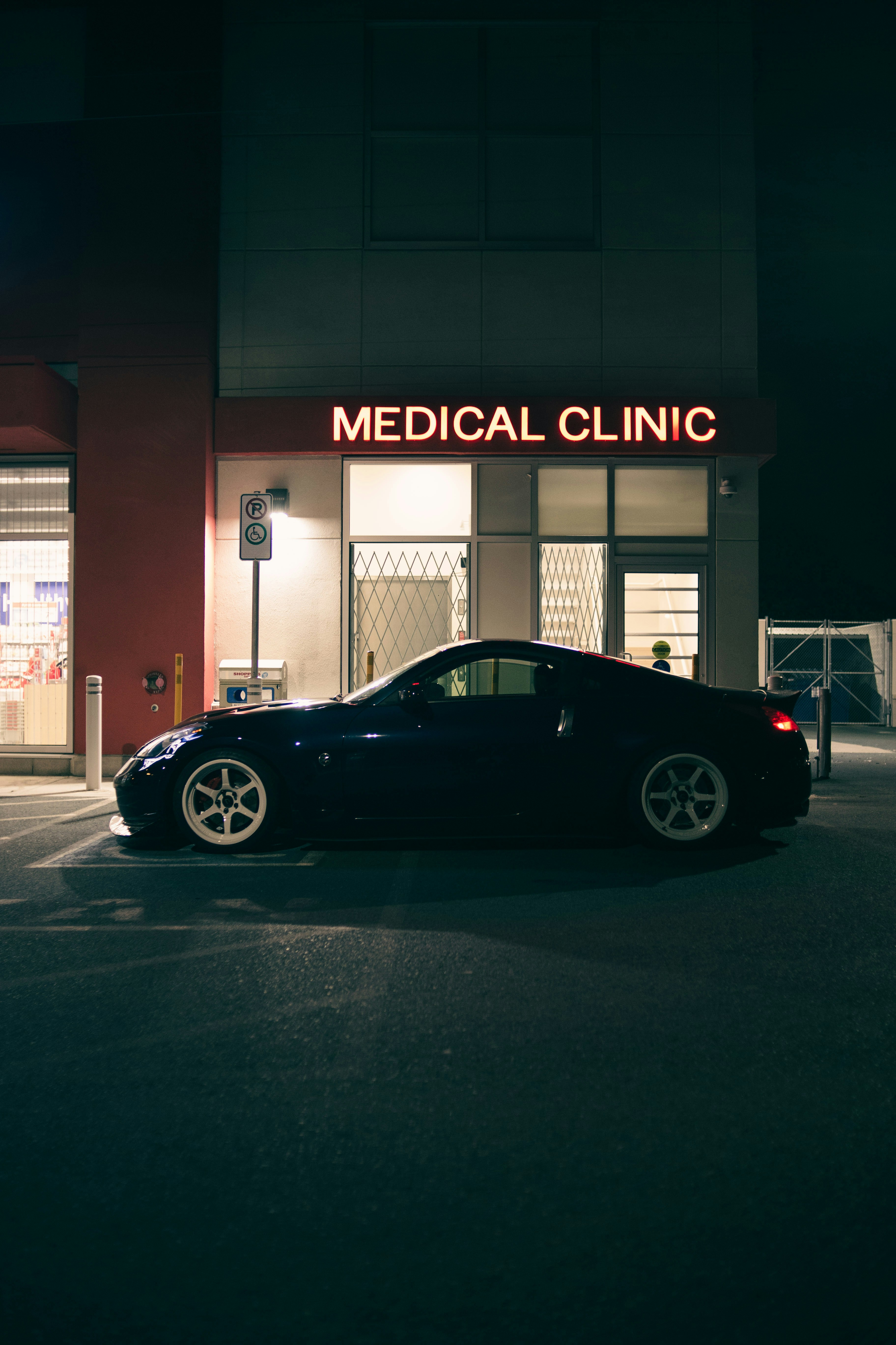 a black car parked outside a building