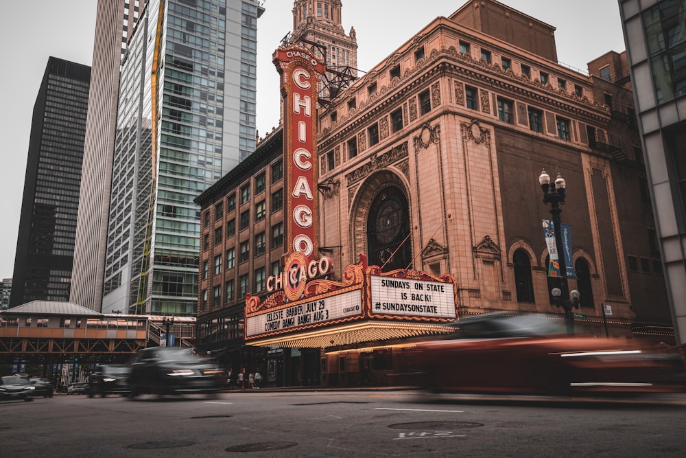 a large building with a sign on it with Chicago Theatre in the background