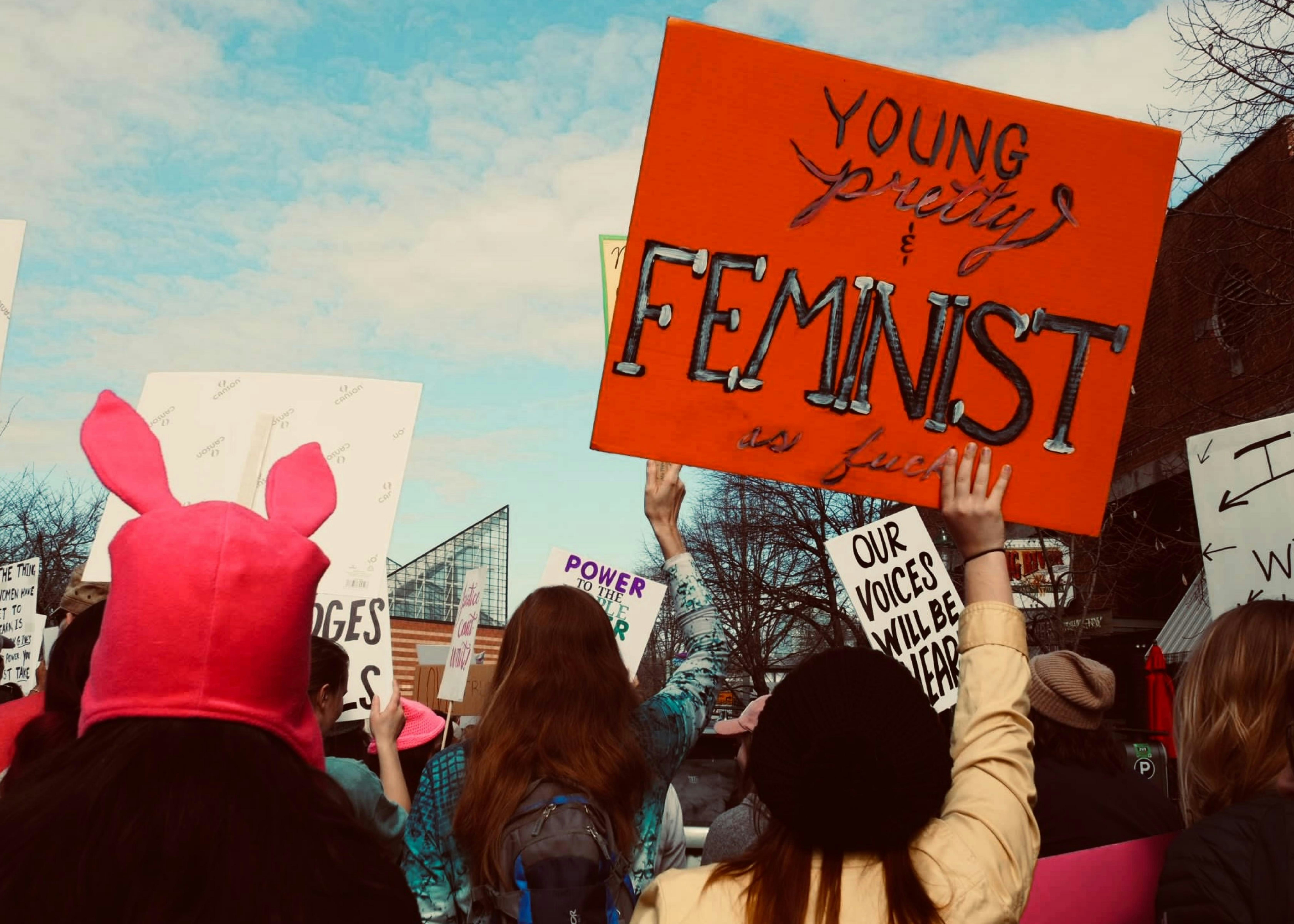 a group of people holding signs