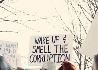 a group of people holding signs