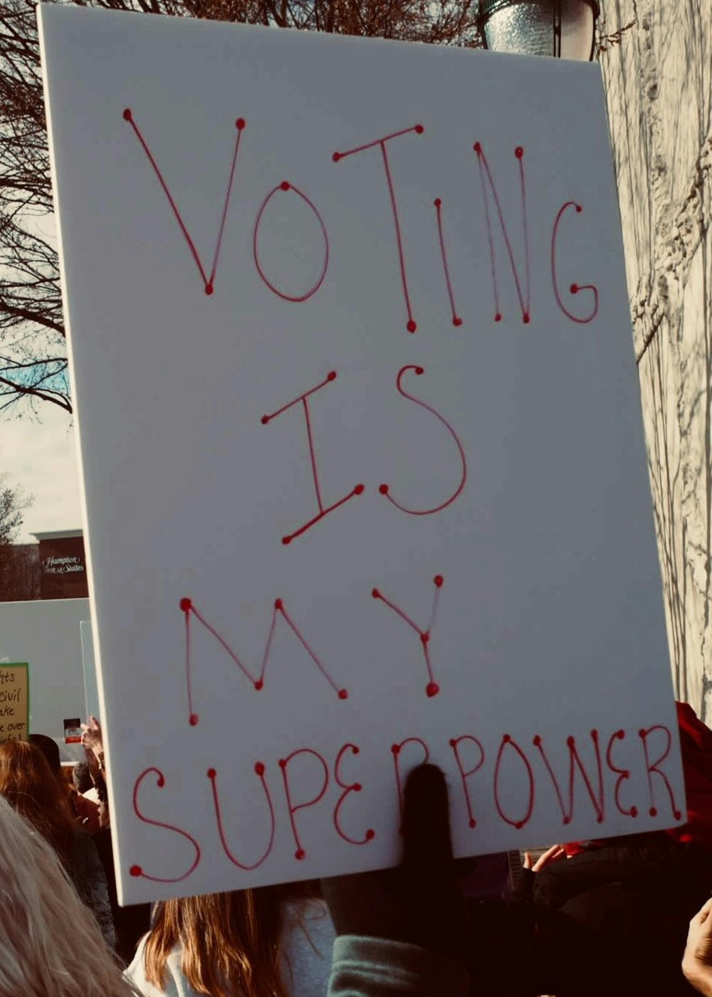 a sign with red writing