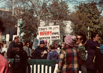 a group of people holding signs