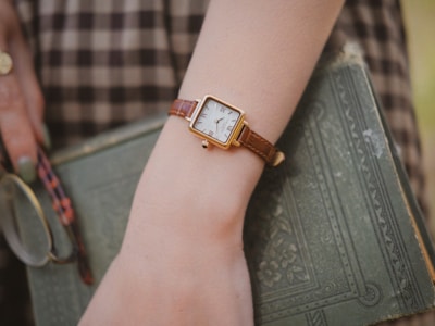 Fioranzo watch boxed elegantly beside an open book, illustrating a lifestyle of refinement.