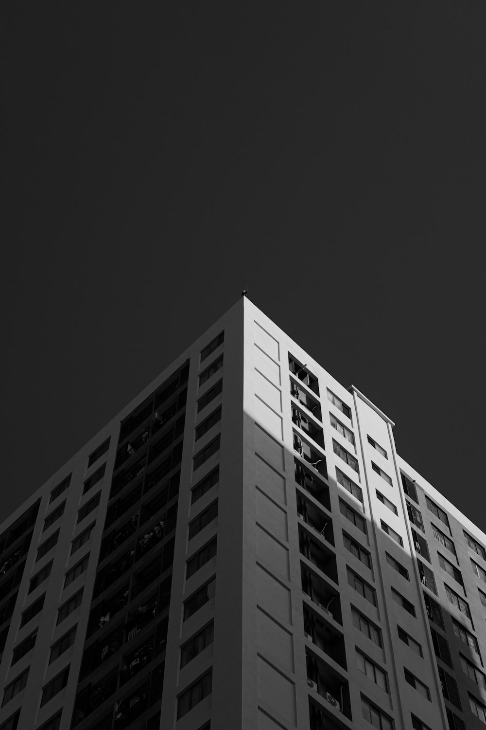 a tall building with a dark sky