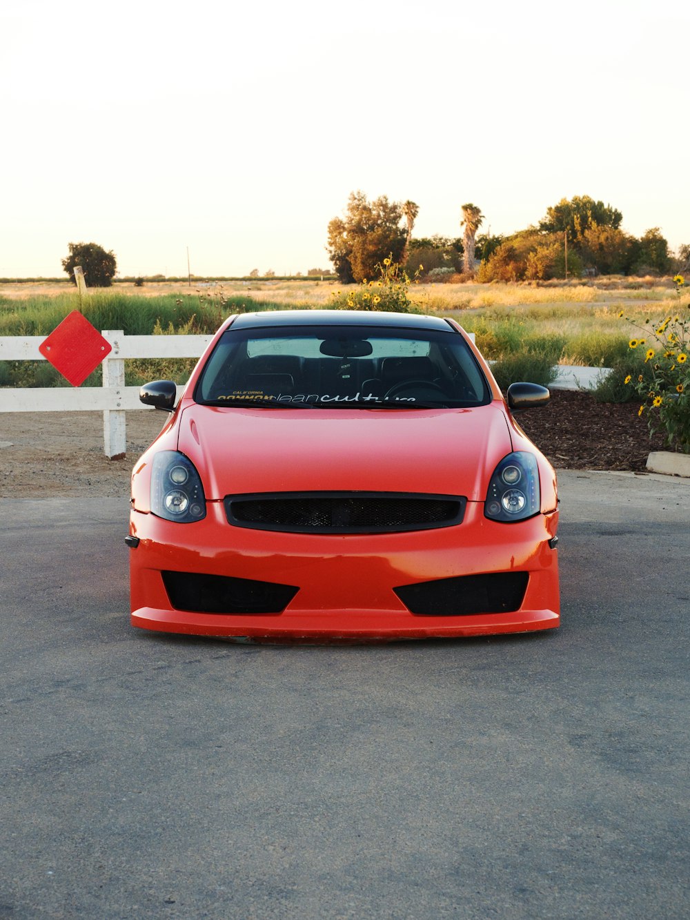 a red car parked on a road