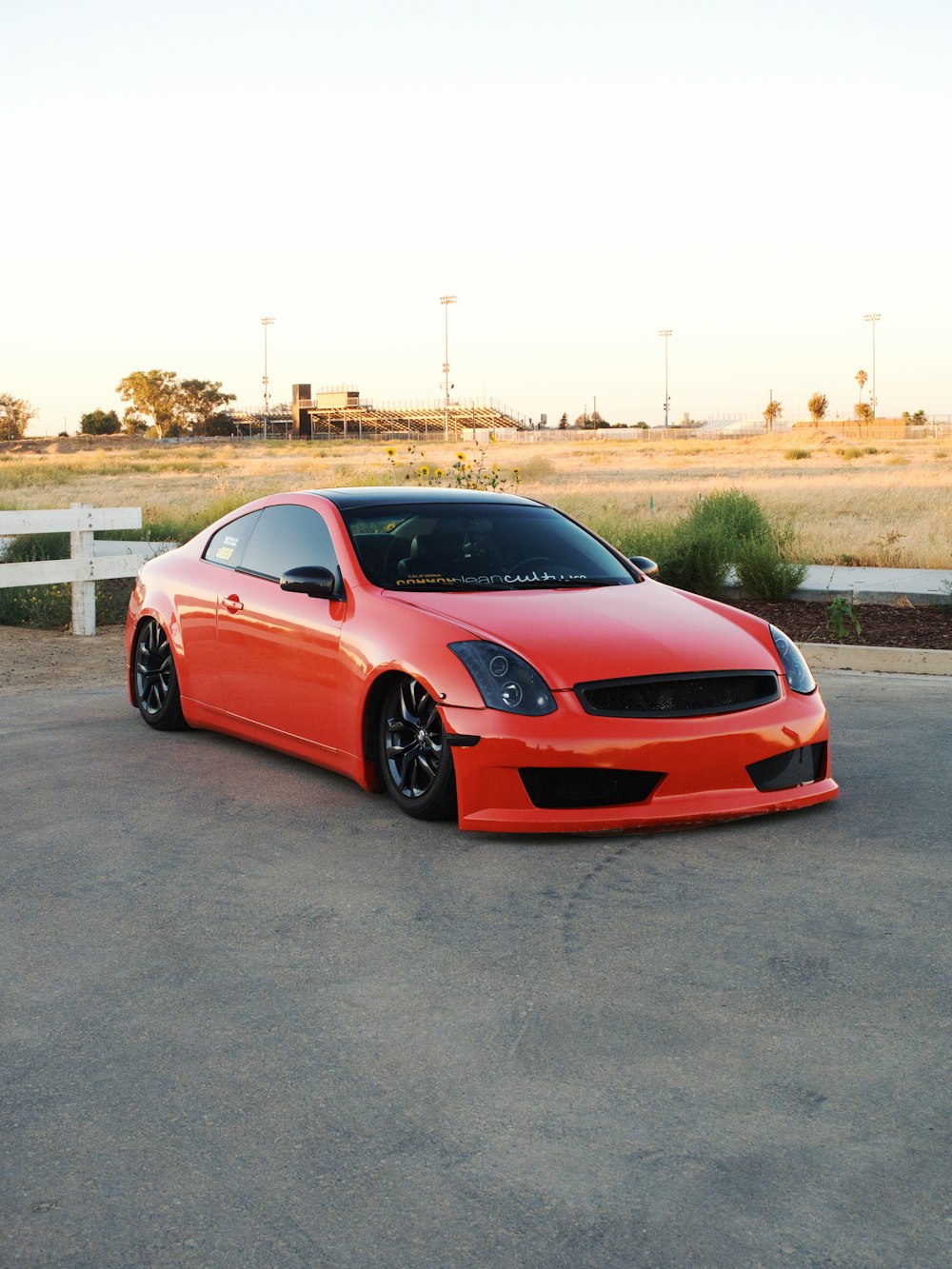 a red car parked on a road