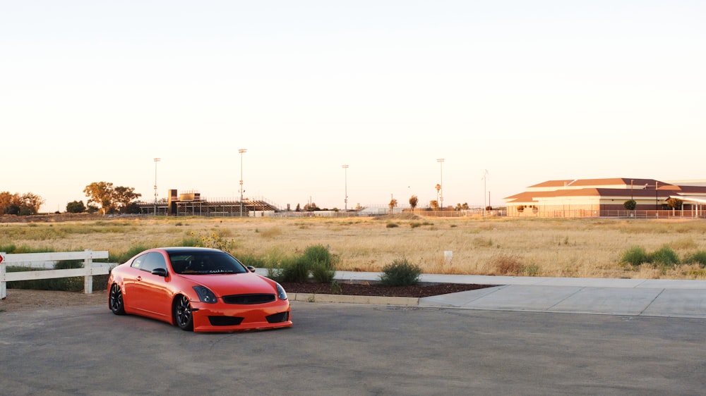 a red car parked on a road