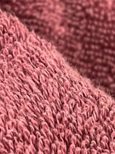 Close-up of pink and nude fitness leggings fabric texture.