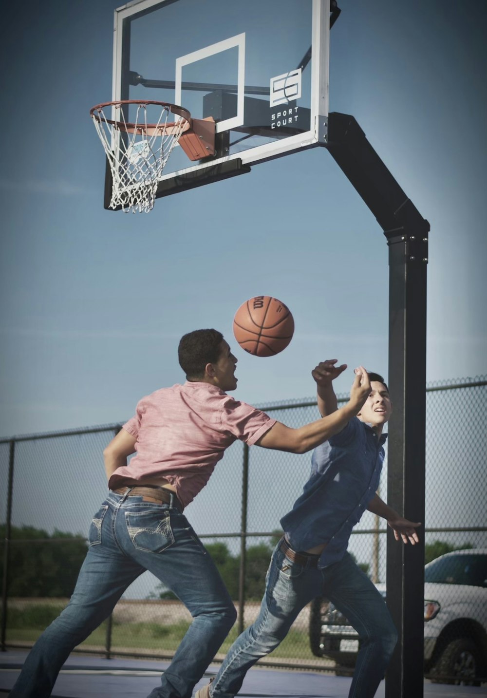 a few men playing basketball
