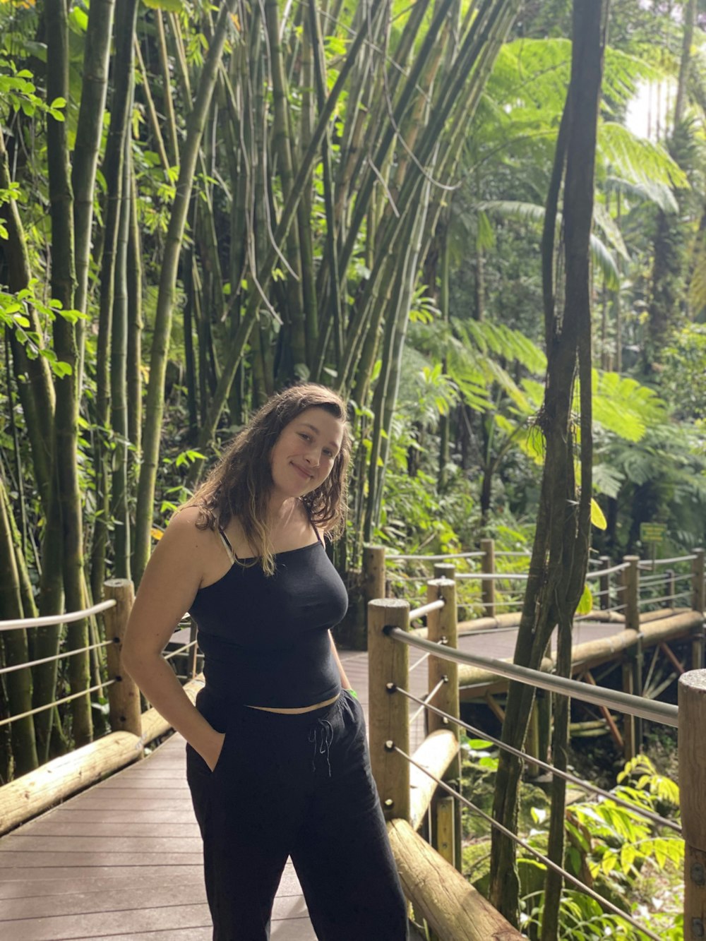 a woman standing on a bridge