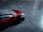 Close-up of a bright, detailed toy car from grynlax feton llc on a wooden floor.
