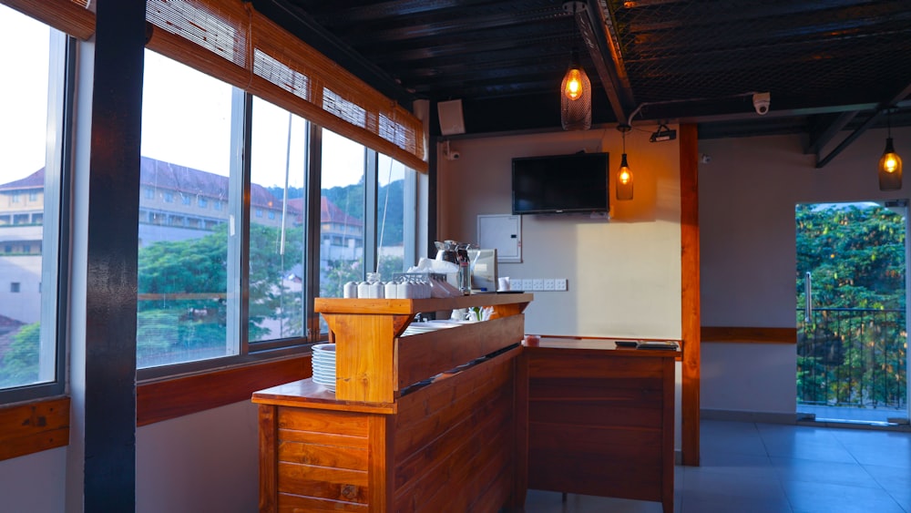 a kitchen with large windows