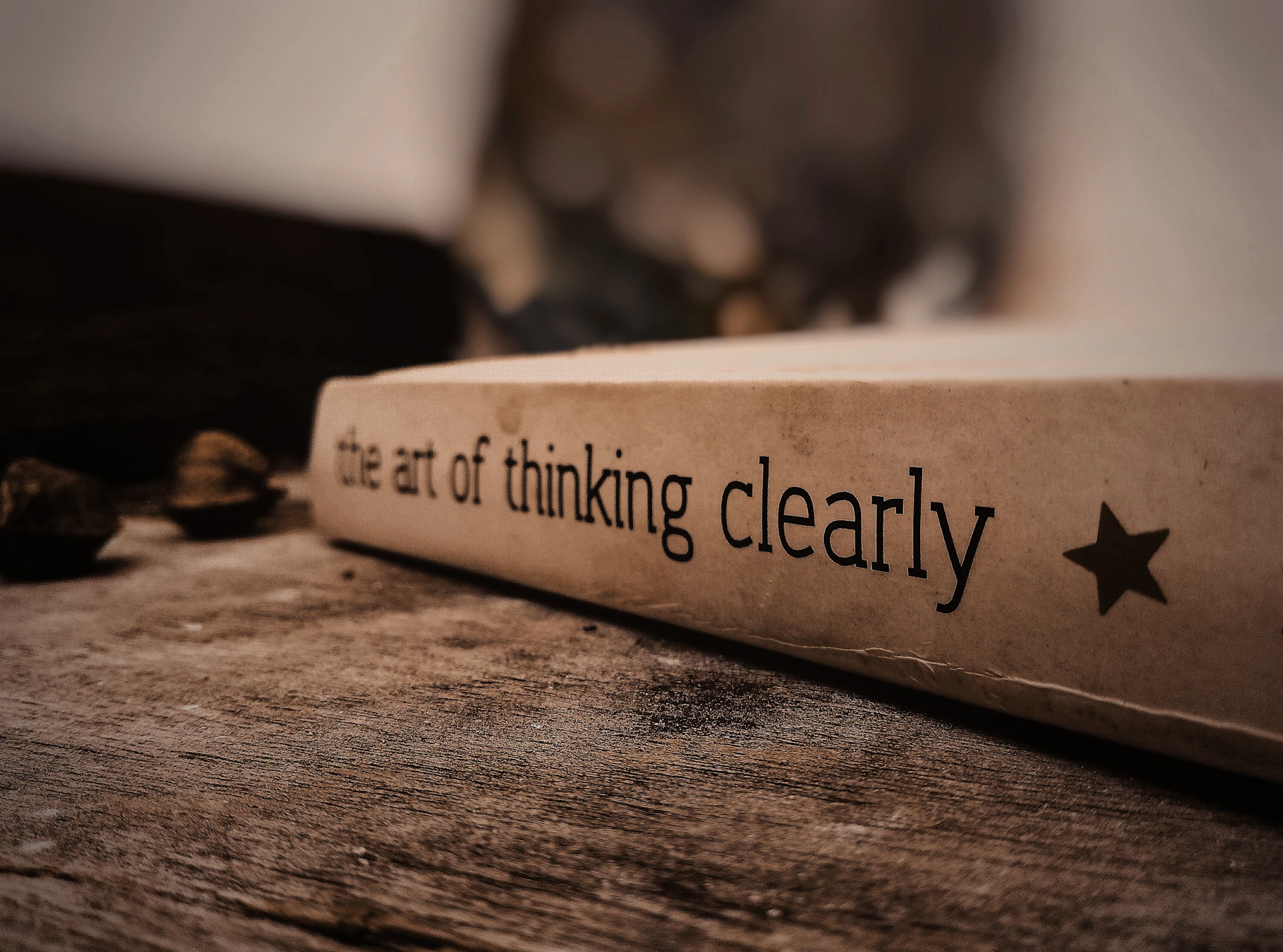 a white box with black text on a wooden surface
