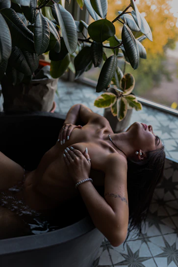 a couple of women lying on a couch