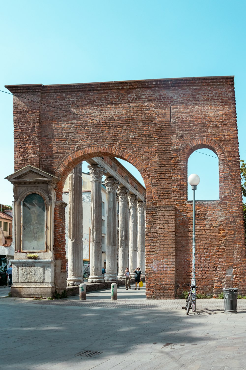 a brick building with a large arched doorway