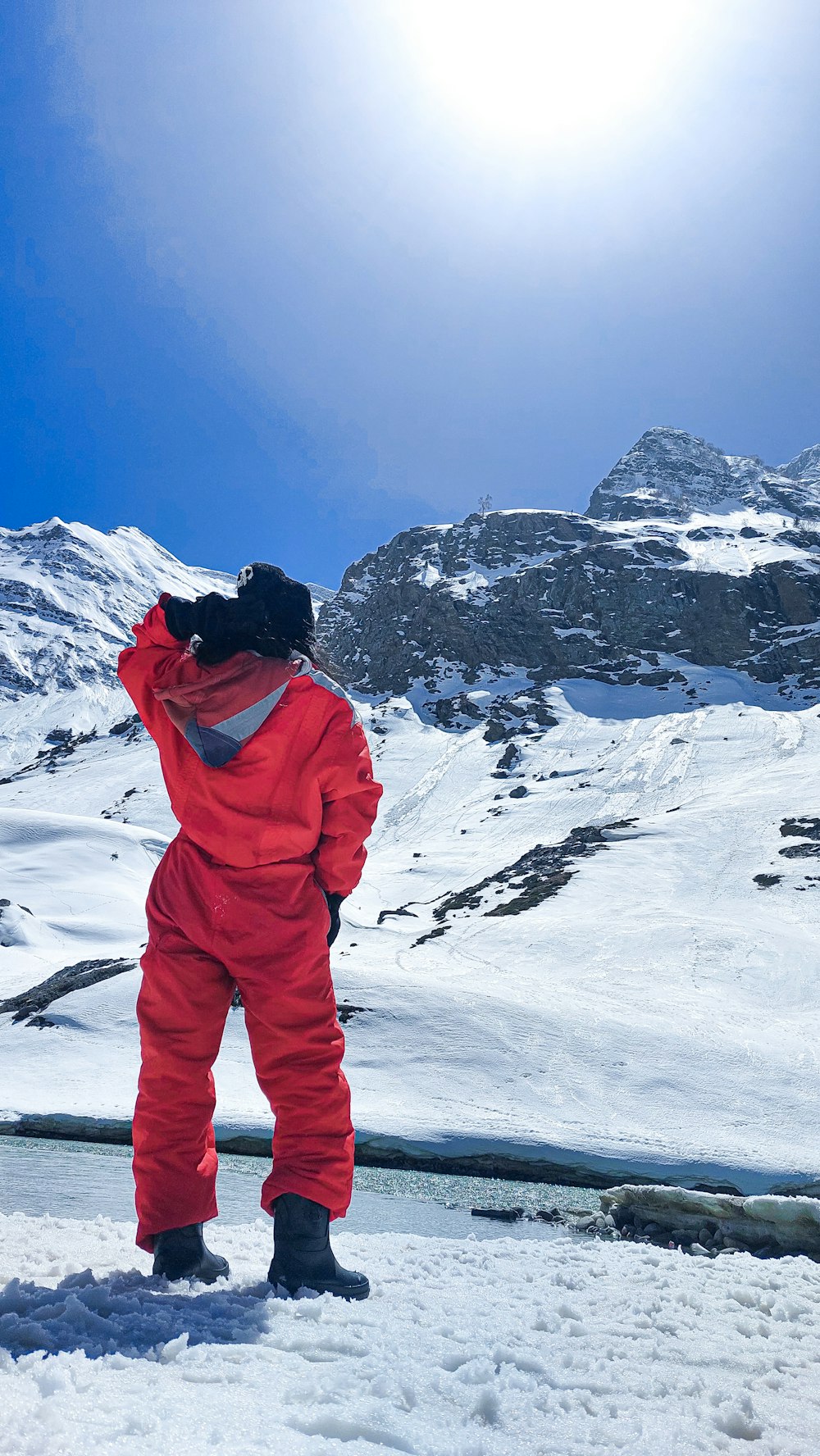 a person standing on a snowy mountain