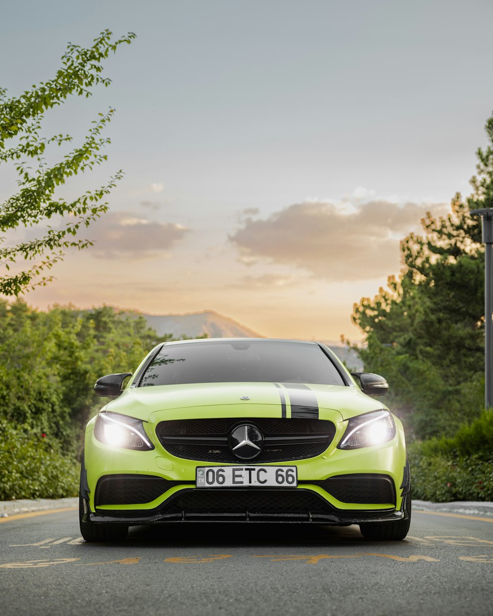 a green car on a road