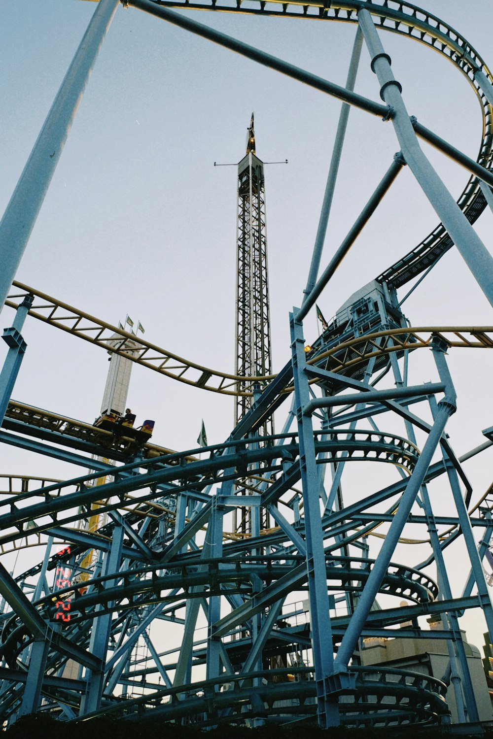 a roller coaster with a blue sky