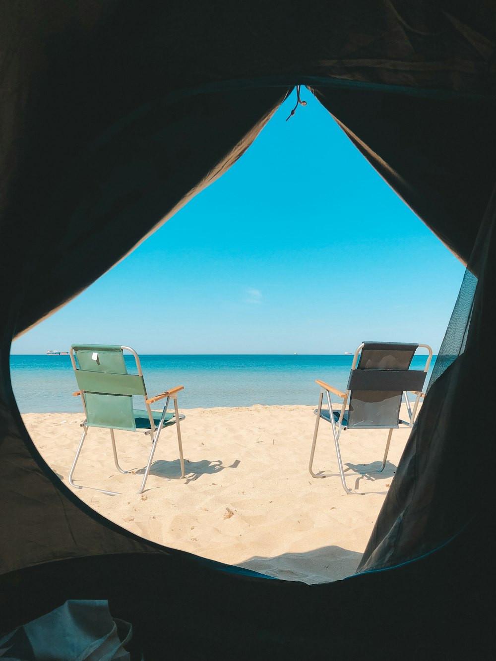 chairs and a table on a beach