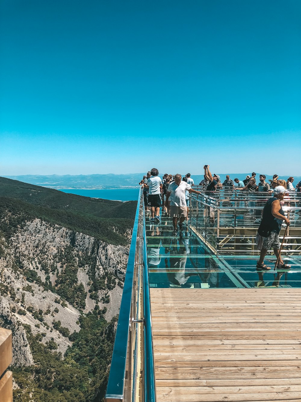 a group of people on a bridge