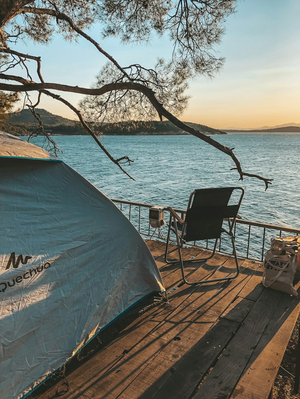 a blue tent on a dock