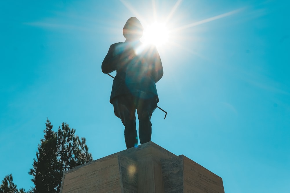 a statue of a man with a light shining on him