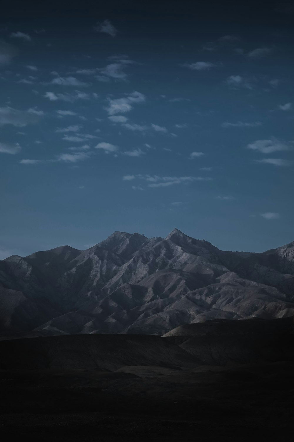 a mountain range with a blue sky