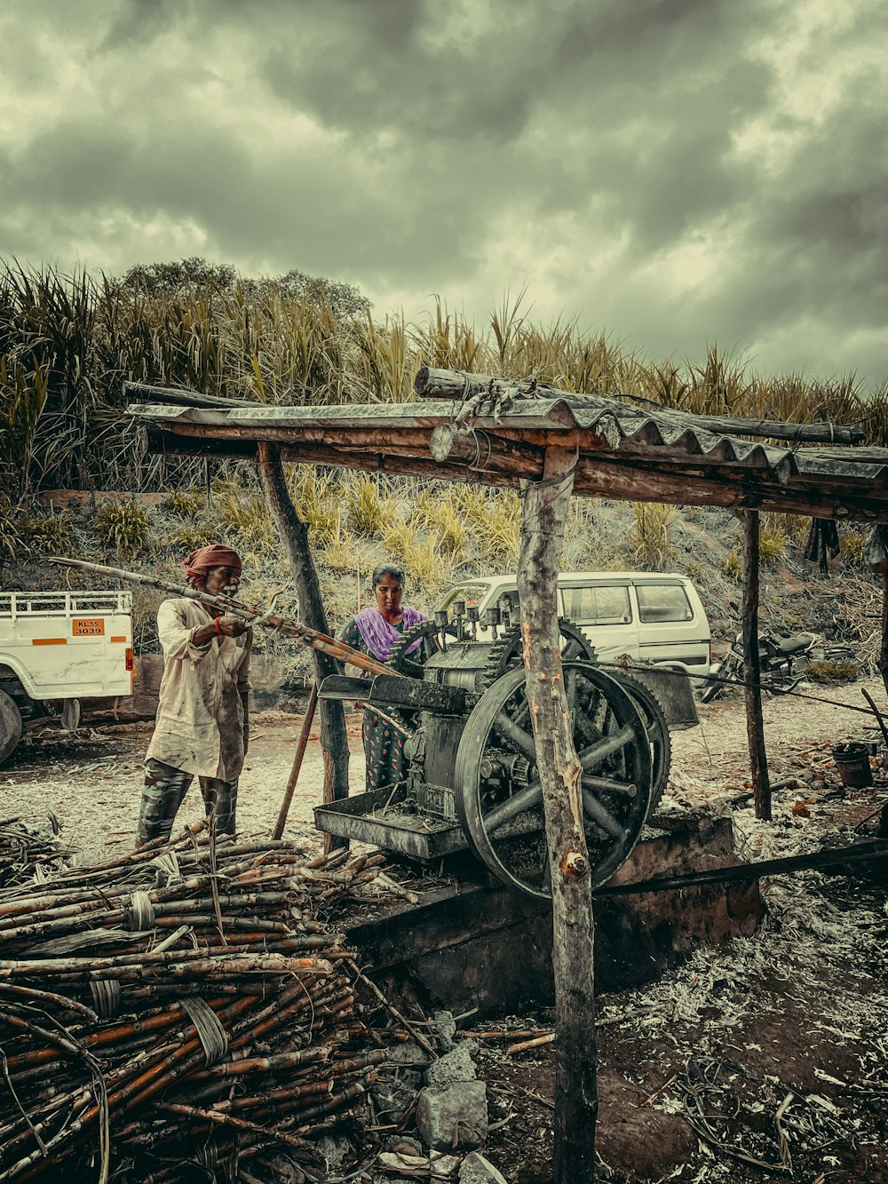 a few men standing next to a tractor