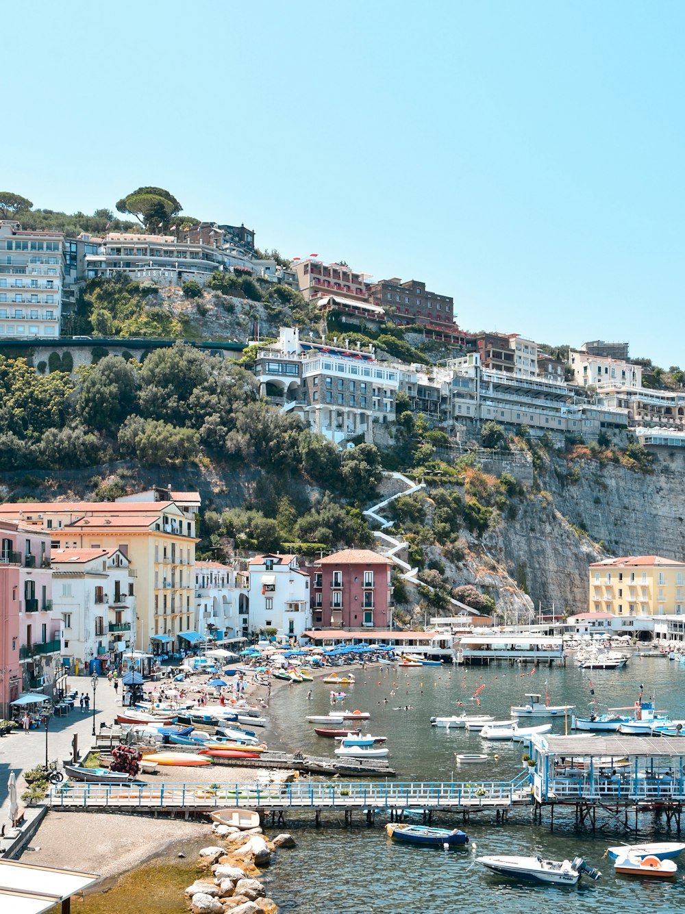 a city with many buildings and boats