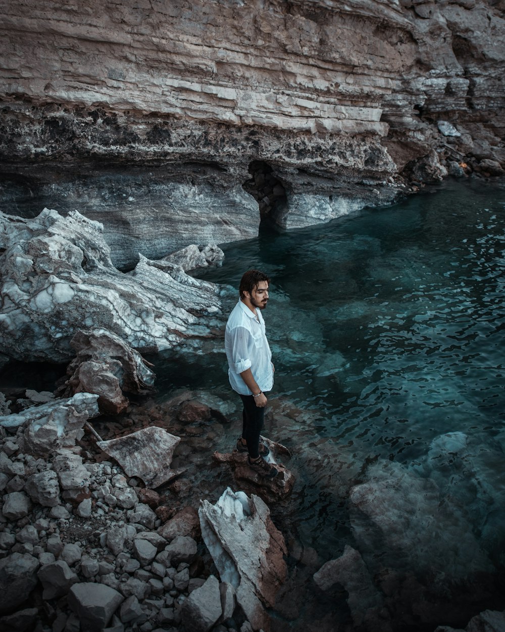 a man standing in a cave