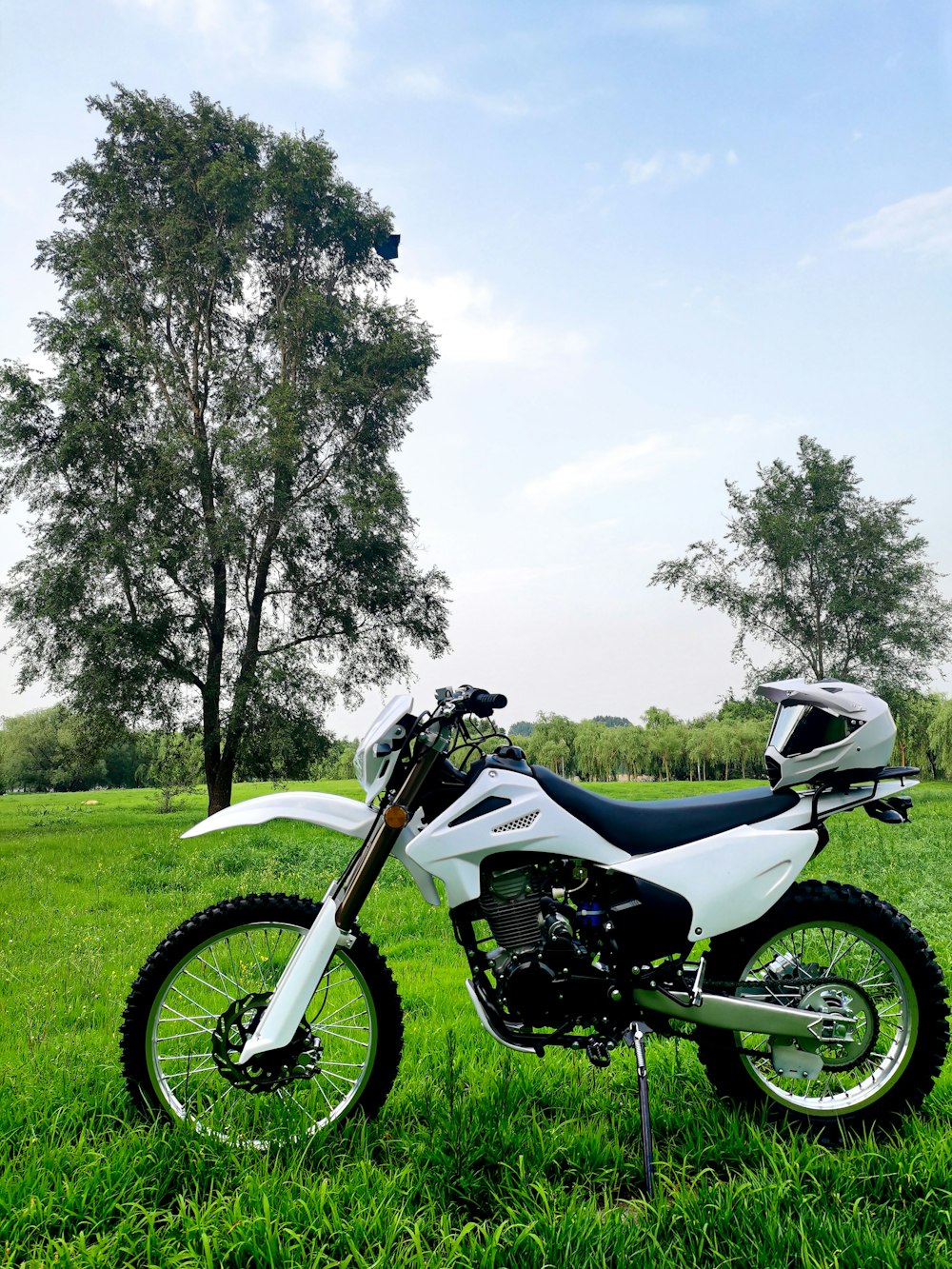 a motorcycle parked in a grassy field