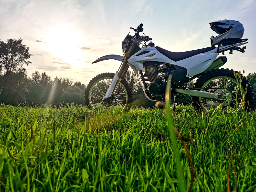 a motorcycle parked in a grassy field