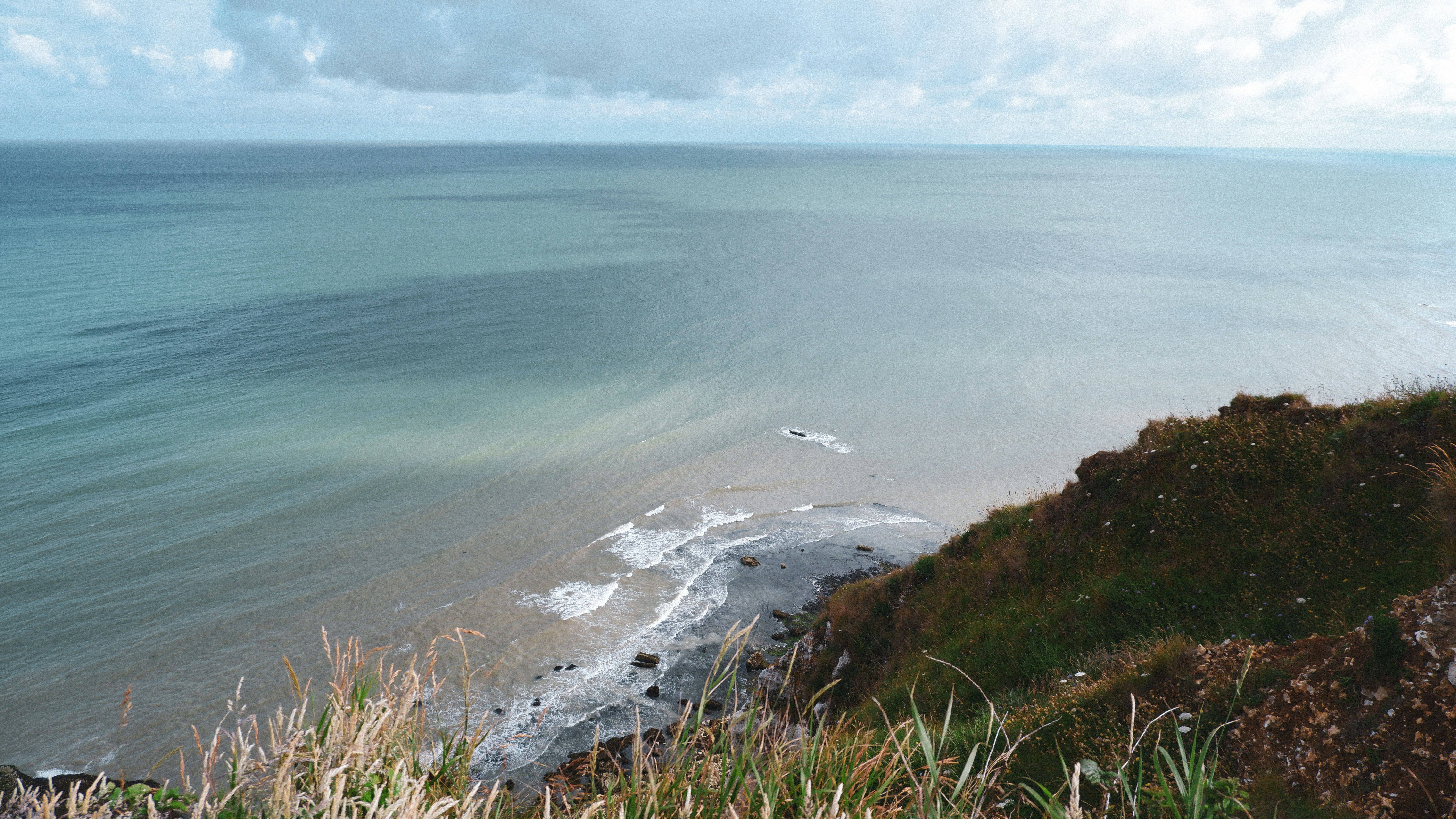 a beach with a body of water