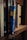 A close-up view of a shelf lined with several books. One book has a bright blue spine with the title 'Ten Year Career' by Jodie Cook written in yellow block letters. Surrounding it are various other books with titles visible, including 'Gray Vaughan' and 'Maier'. The books are neatly arranged, creating a sense of order.