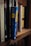 A close-up view of a shelf lined with several books. One book has a bright blue spine with the title 'Ten Year Career' by Jodie Cook written in yellow block letters. Surrounding it are various other books with titles visible, including 'Gray Vaughan' and 'Maier'. The books are neatly arranged, creating a sense of order.